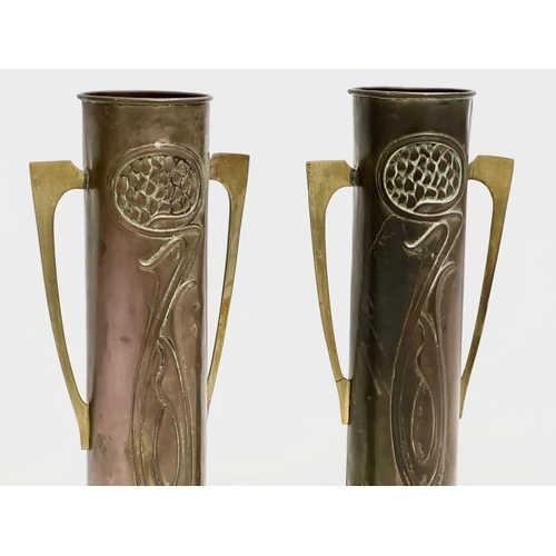 46 - A pair of early 20th century Art Nouveau copper and brass vases by Beldray. 31cm