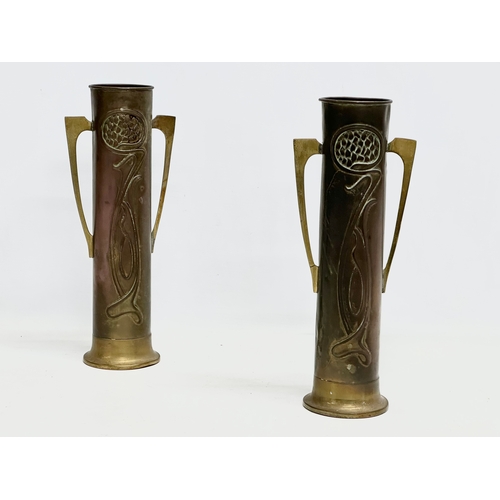 46 - A pair of early 20th century Art Nouveau copper and brass vases by Beldray. 31cm