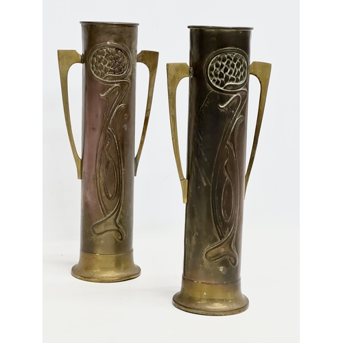 46 - A pair of early 20th century Art Nouveau copper and brass vases by Beldray. 31cm