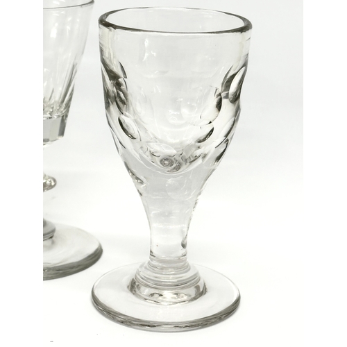 48 - A collection of early 20th century drinking glasses. A George III style gin glass, circa 1920. 3 lat... 