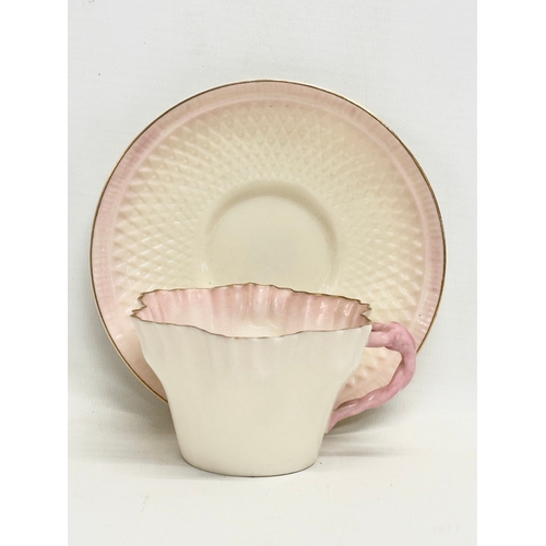 51 - 2 second period Belleek pottery cups and saucers, with 1 later saucer. Circa 1926-1946.