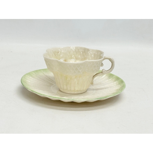 51 - 2 second period Belleek pottery cups and saucers, with 1 later saucer. Circa 1926-1946.