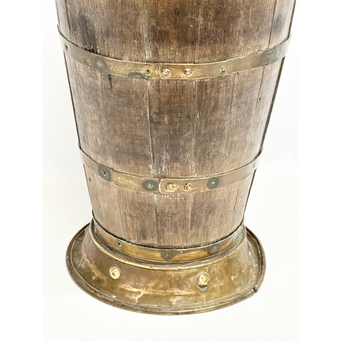 54 - A large late 19th century French oak brass bound Grape Hod/stickstand. 30x65cm