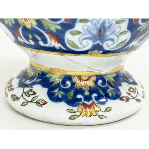 55 - A late 19th century North European hand painted ceramic pot with 2 handles. 16x32cm