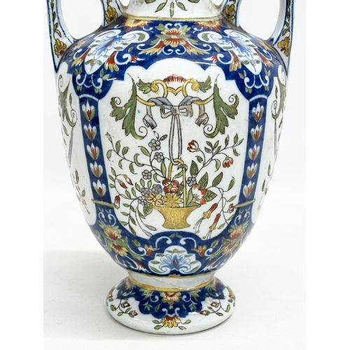 55 - A late 19th century North European hand painted ceramic pot with 2 handles. 16x32cm