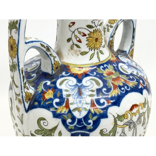 55 - A late 19th century North European hand painted ceramic pot with 2 handles. 16x32cm