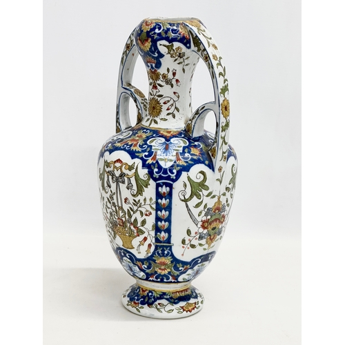 55 - A late 19th century North European hand painted ceramic pot with 2 handles. 16x32cm