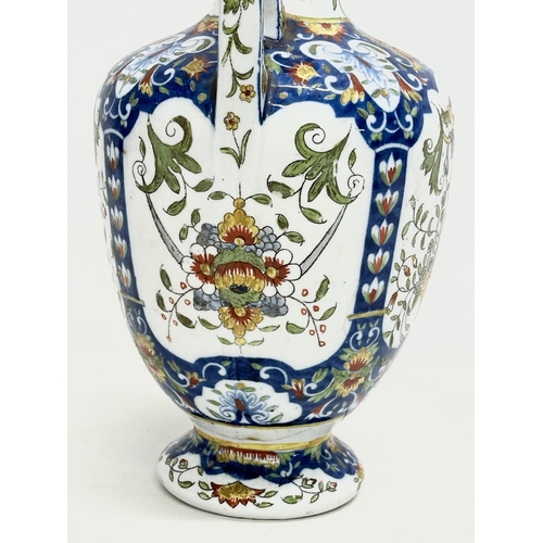 55 - A late 19th century North European hand painted ceramic pot with 2 handles. 16x32cm