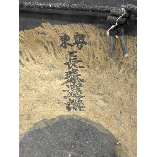 58 - A late 19th/early 20th century Chinese brass gong in a later rosewood frame. 46x21x68cm