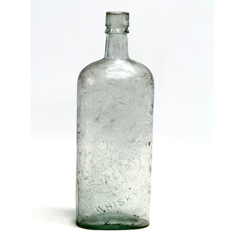 9 - A rare 19th century Duncan Alderdice & Co ‘The Native’ glass whisky bottle. 25cm