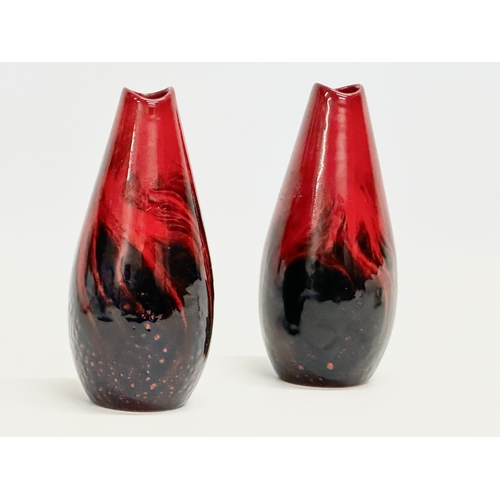 74 - A pair of Royal Doulton ‘Flambe Veined’ vases. Number 1613. 17cm.