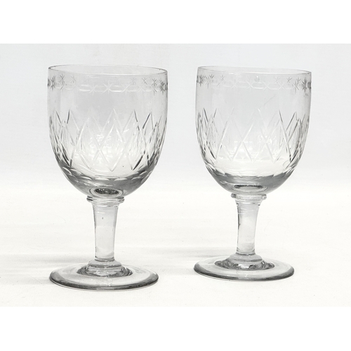 31 - A pair of Victorian etched glass wine goblets. Circa 1840-1860. 8x14.5cm