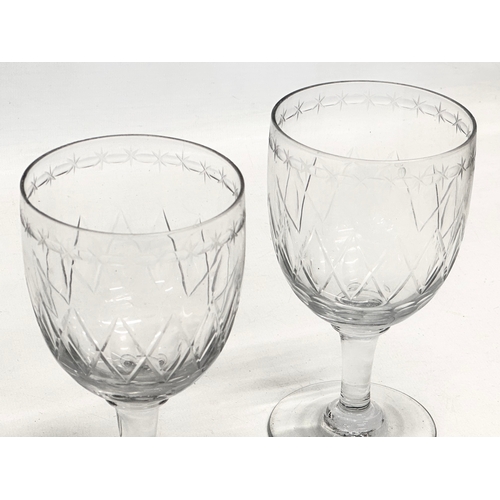 31 - A pair of Victorian etched glass wine goblets. Circa 1840-1860. 8x14.5cm