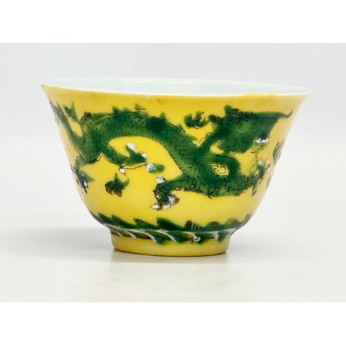 16 - A 19th century Chinese emperor Tongzhi (1856-1875) yellow ground porcelain rice bowl with green enam... 