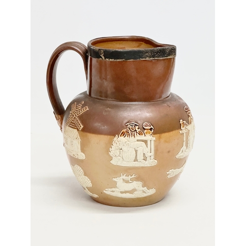 82 - A late 19th century silver rimmed Doulton Lambeth stoneware jug. 17x15x17cm