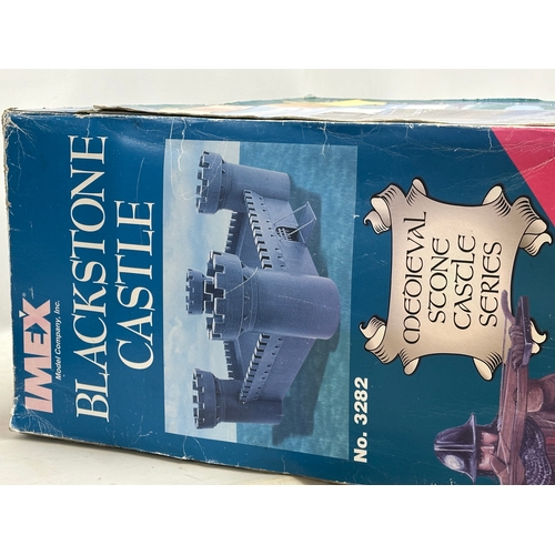 653 - A large unused Imex Model Company INC Medieval Stone Castle Series ‘Blackstone Castle’  with box and... 
