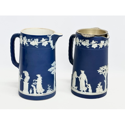 88 - 4 pieces of late 19th century Wedgwood Jasper Ware. A pair of jugs 17x19.5cm. A pair of cylinder vas... 