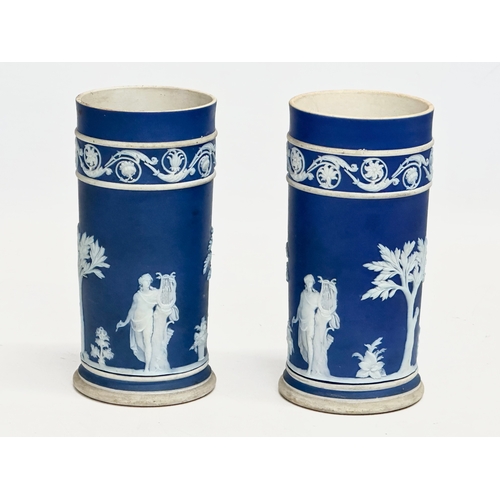 88 - 4 pieces of late 19th century Wedgwood Jasper Ware. A pair of jugs 17x19.5cm. A pair of cylinder vas... 