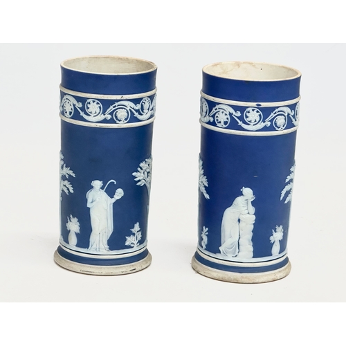 88 - 4 pieces of late 19th century Wedgwood Jasper Ware. A pair of jugs 17x19.5cm. A pair of cylinder vas... 