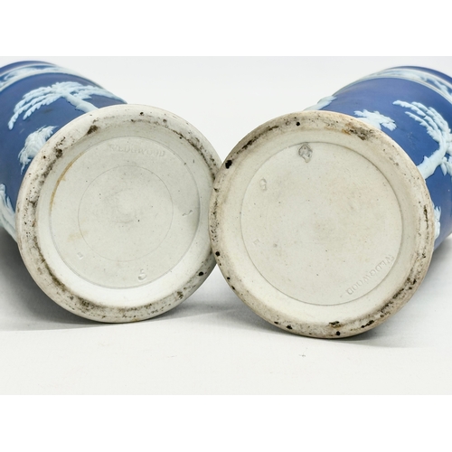 88 - 4 pieces of late 19th century Wedgwood Jasper Ware. A pair of jugs 17x19.5cm. A pair of cylinder vas... 