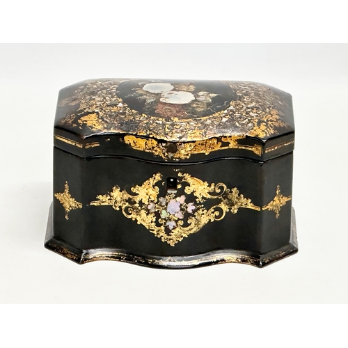 17 - A mid 19th century Jennens & Bettridge gilt and Mother of Pearl inlaid lacquered tea caddy with orig... 