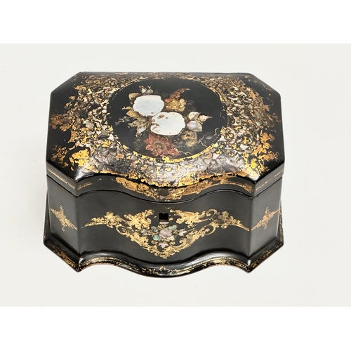 17 - A mid 19th century Jennens & Bettridge gilt and Mother of Pearl inlaid lacquered tea caddy with orig... 