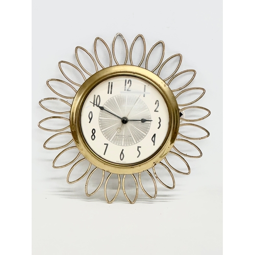 93 - A Mid Century Sunburst wall clock. Westclox Electric. 1950’s/1960’s. 28cm