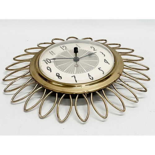 93 - A Mid Century Sunburst wall clock. Westclox Electric. 1950’s/1960’s. 28cm