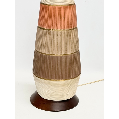 104 - A 1960’s Mid Century table lamp on teak base. 54cm