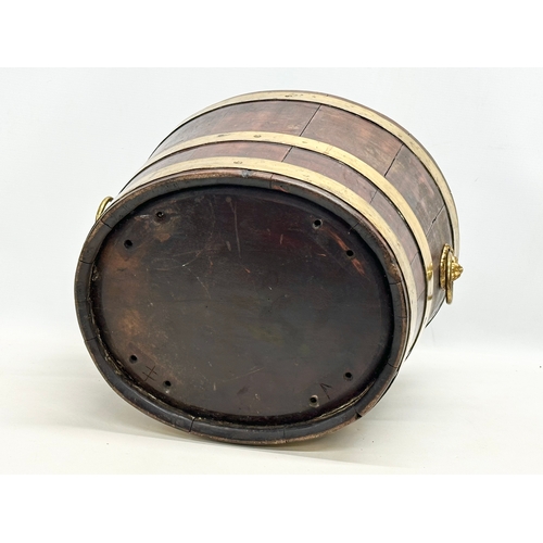 22 - A George III brass bound wine cooler with lion ring handles and original liner. Circa 1780-1790. 43x... 