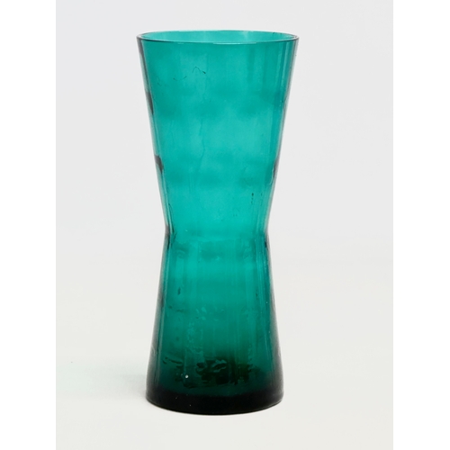 132 - A Swedish Mid Century glass vase designed by Fabian Lundqvist for Alsterfors. 1950. 7x16cm