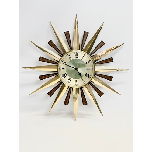 94 - A Mid Century sunburst wall clock by Metamec. 59cm