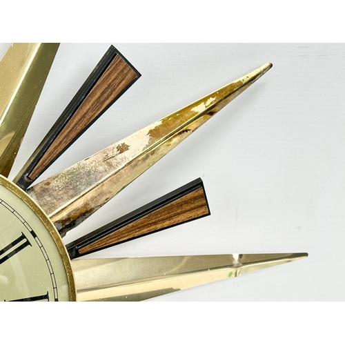 94 - A Mid Century sunburst wall clock by Metamec. 59cm