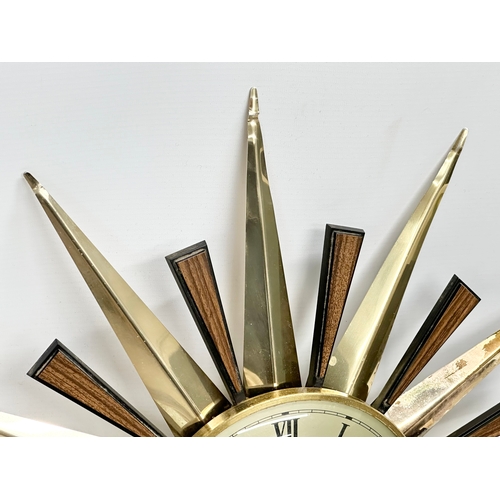 94 - A Mid Century sunburst wall clock by Metamec. 59cm