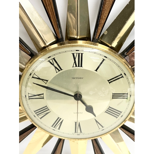 94 - A Mid Century sunburst wall clock by Metamec. 59cm