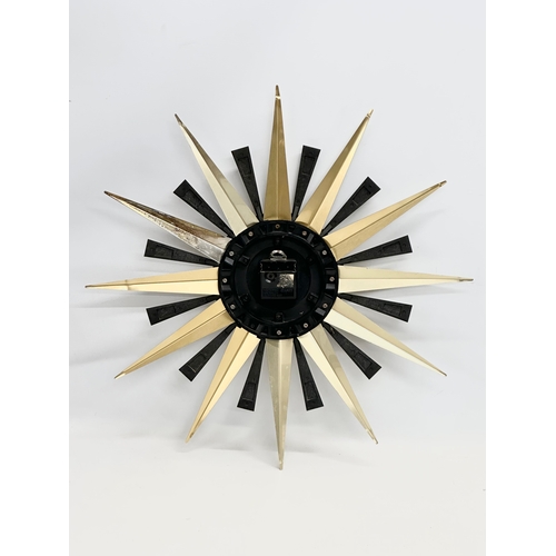 94 - A Mid Century sunburst wall clock by Metamec. 59cm