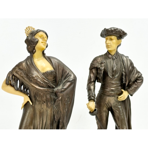 27 - A pair of 1930’s Art Deco spelter and faux ivory figures on marble bases. 26.5cm