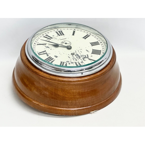 196 - A large Ships bulkhead clock. 33x14cm