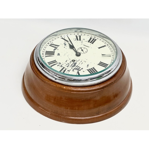 196 - A large Ships bulkhead clock. 33x14cm