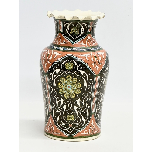 127 - A mid 19th century Iznik glazed stoneware vase with frilled rim. 12.5x21cm