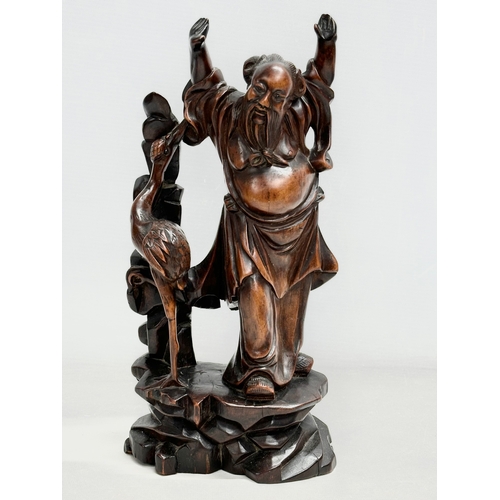 151 - 2 19th century Chinese carved boxwood and rosewood figures. 31cm