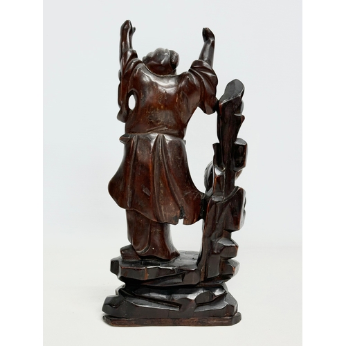 151 - 2 19th century Chinese carved boxwood and rosewood figures. 31cm