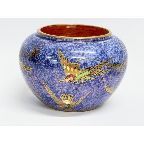 128 - Wedgwood Fairyland. A 1925 Wedgwood lustre ‘Hummingbird’ pot, Z5294. A 1918 Wedgwood lustre ‘Humming... 