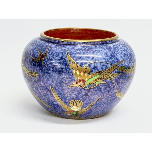 128 - Wedgwood Fairyland. A 1925 Wedgwood lustre ‘Hummingbird’ pot, Z5294. A 1918 Wedgwood lustre ‘Humming... 