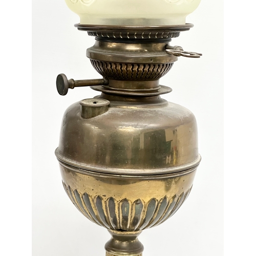 113 - A tall Victorian brass oil lamp. 71cm