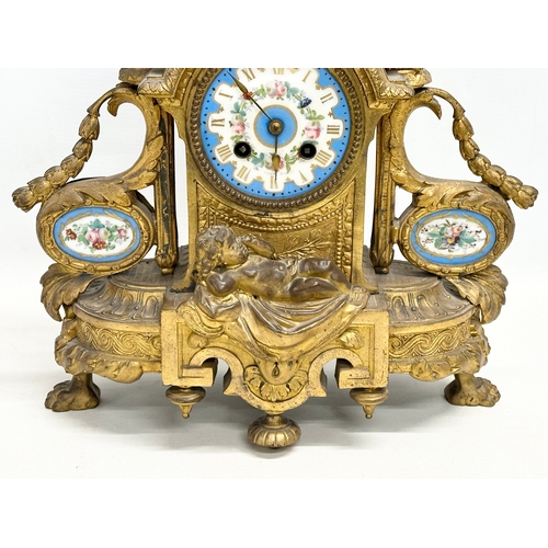 115 - A mid 19th century Henry Marc gilt brass mantle clock, decorated with cherubs and hand painted porce... 