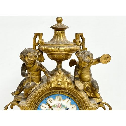 115 - A mid 19th century Henry Marc gilt brass mantle clock, decorated with cherubs and hand painted porce... 