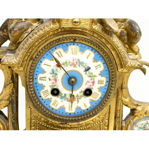 115 - A mid 19th century Henry Marc gilt brass mantle clock, decorated with cherubs and hand painted porce... 