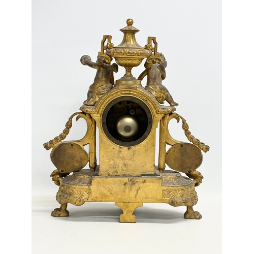 115 - A mid 19th century Henry Marc gilt brass mantle clock, decorated with cherubs and hand painted porce... 