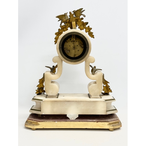 129 - A large late 19th century French onyx and gilt brass mantle clock on stand. 40x12x49cm